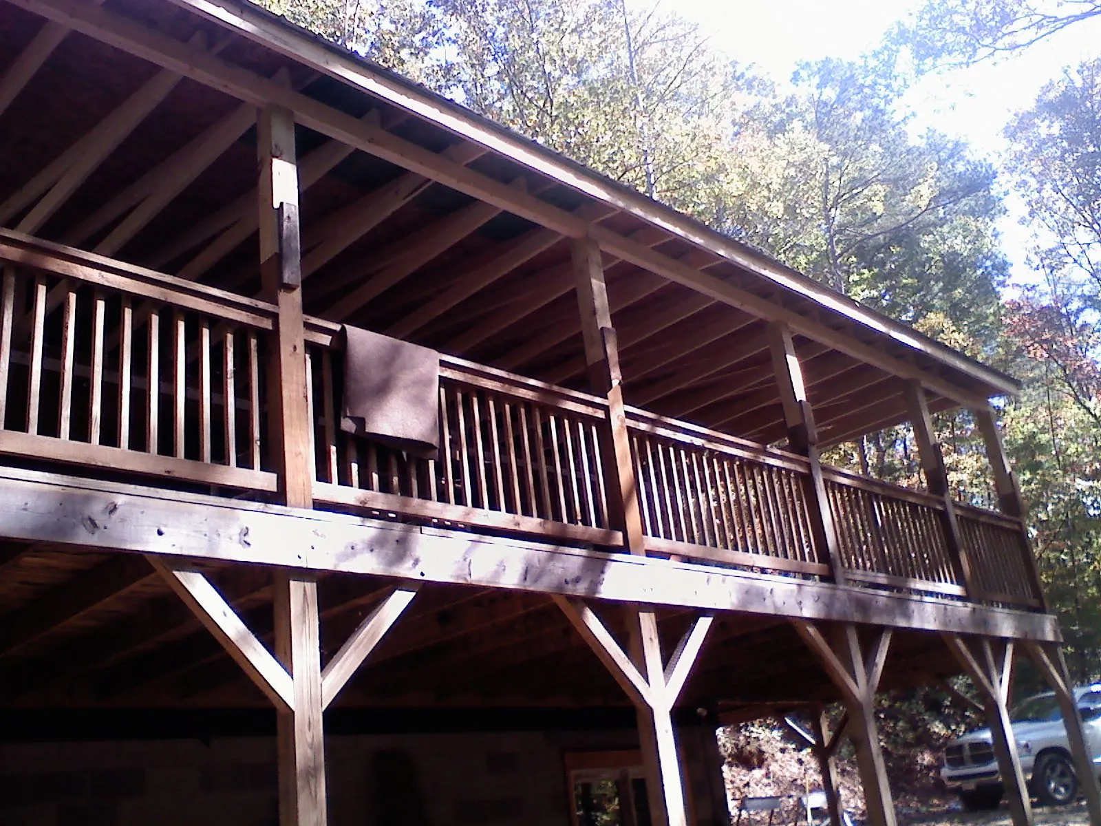 Timber framing under a new elevated porch and deck — Roof Leak Repair in Poplarville by Roofing Brothers
